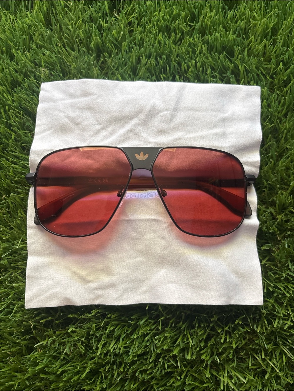 adidas Men’s Black Frame Sunglasses with Red Lenses
